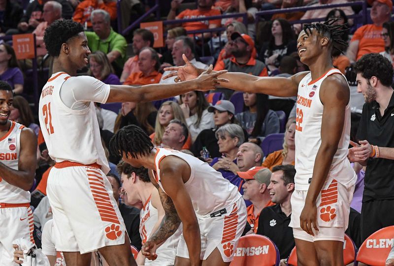 Feb 22, 2023; Clemson, South Carolina, USA; Clemson forward Chauncey Wiggins (21) and forward RJ Godfrey (22) celebrate against Syracuse during the second half at Littlejohn Coliseum. Mandatory Credit: Ken Ruinard-USA TODAY Sports