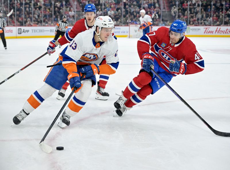 Jan 25, 2024; Montreal, Quebec, CAN; New York Islanders forward Matthew Barzal (13) plays the puck and Montreal Canadiens defenseman Jayden Struble (47) defends during the second period at the Bell Centre. Mandatory Credit: Eric Bolte-USA TODAY Sports