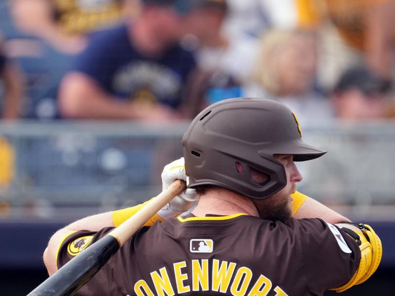 Feb 24, 2024; Peoria, Arizona, USA; San Diego Padres first baseman Jake Cronenworth (9) bats against the Milwaukee Brewers during the second inning of a Spring Training game at Peoria Sports Complex. Mandatory Credit: Joe Camporeale-USA TODAY Sports