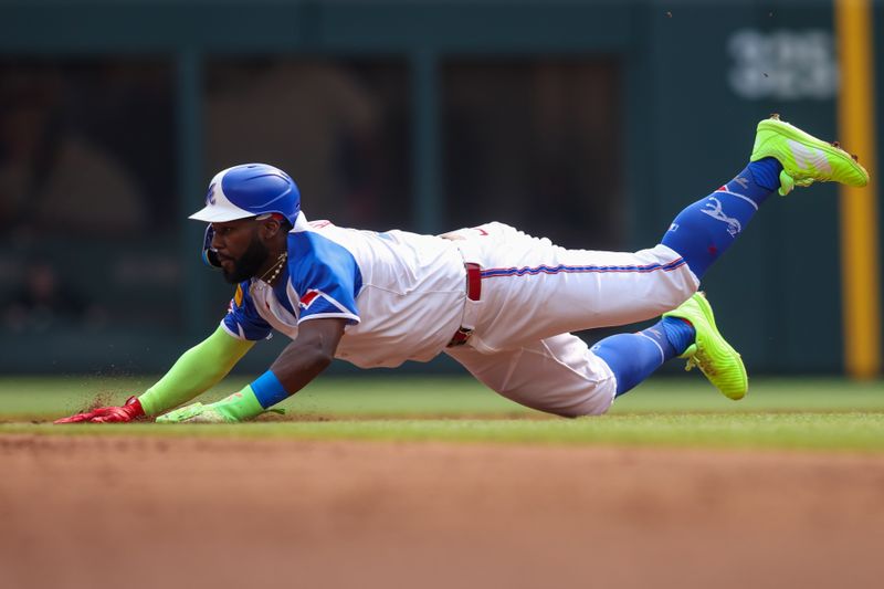 May 31, 2025; Atlanta, Georgia, USA; Atlanta Braves center fielder Michael Harris II (23) steals second base against the Boston Red Sox in the second inning at Truist Park. Mandatory Credit: Brett Davis-Imagn Images