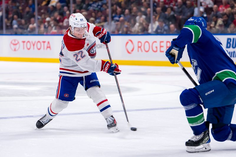 Mar 21, 2024; Vancouver, British Columbia, CAN; Montreal Canadiens forward Cole Caufield (22) shoots against the Vancouver Canucks in the second period at Rogers Arena. Mandatory Credit: Bob Frid-USA TODAY Sports