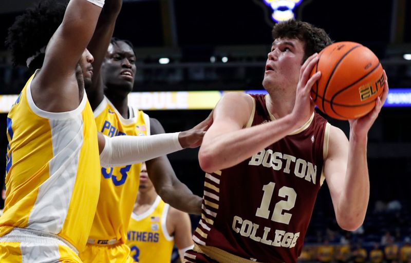 Feb 14, 2023; Pittsburgh, Pennsylvania, USA;  Boston College Eagles forward Quinten Post (12) looks to shoot the ball against the Pittsburgh Panthers during the first half at the Petersen Events Center. Mandatory Credit: Charles LeClaire-USA TODAY Sports