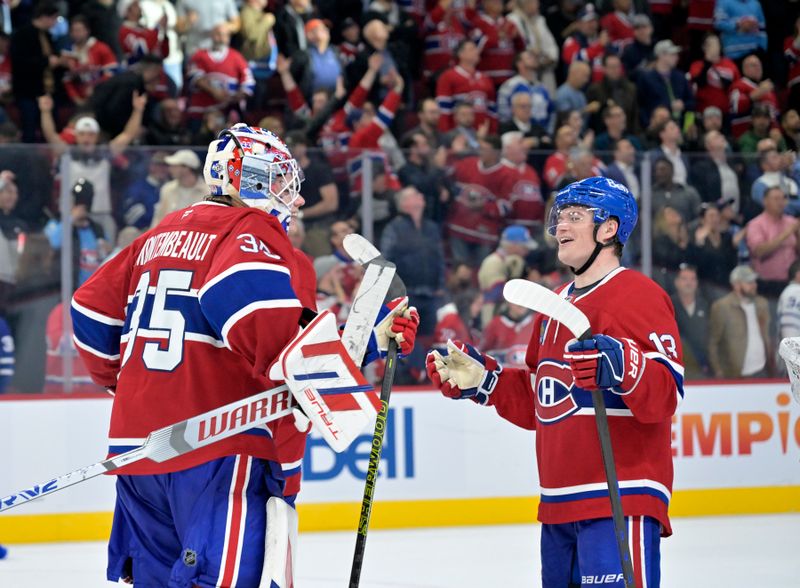 Oct 9, 2024; Montreal, Quebec, CAN; Montreal Canadiens goalie Sam Montembeault (35) celebrates the win against the Toronto Maple Leafs with teammate forward Cole Caufield (13) at the Bell Centre. Mandatory Credit: Eric Bolte-Imagn Images