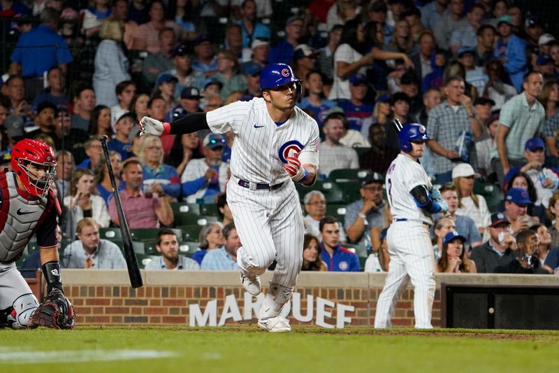 Jul 18, 2023; Chicago, Illinois, USA; Chicago Cubs right fielder Seiya Suzuki (27) hits a one run single against the Washington Nationals during the seventh inning at Wrigley Field. Mandatory Credit: David Banks-USA TODAY Sports