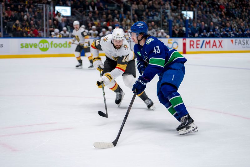 Apr 8, 2024; Vancouver, British Columbia, CAN; Vancouver Canucks defenseman Quinn Hughes (43) drives past Vegas Golden Knights defenseman Nicolas Hague (14) in the first period  at Rogers Arena. Mandatory Credit: Bob Frid-USA TODAY Sports