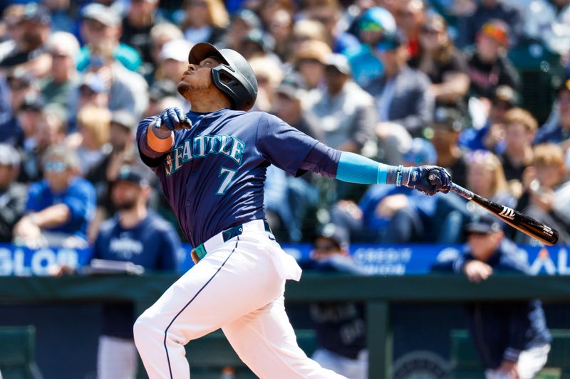 May 1, 2024; Seattle, Washington, USA; Seattle Mariners second baseman Jorge Polanco (7) hits an RBI-single against the Atlanta Braves during the fifth inning at T-Mobile Park. Mandatory Credit: Joe Nicholson-USA TODAY Sports