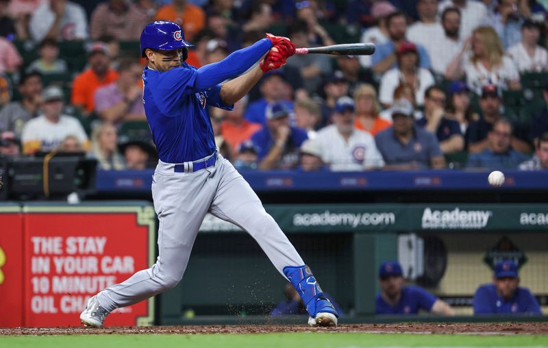 May 17, 2023; Houston, Texas, USA; Chicago Cubs center fielder Christopher Morel (5) hits an infield single during the second inning against the Houston Astros at Minute Maid Park. Mandatory Credit: Troy Taormina-USA TODAY Sports