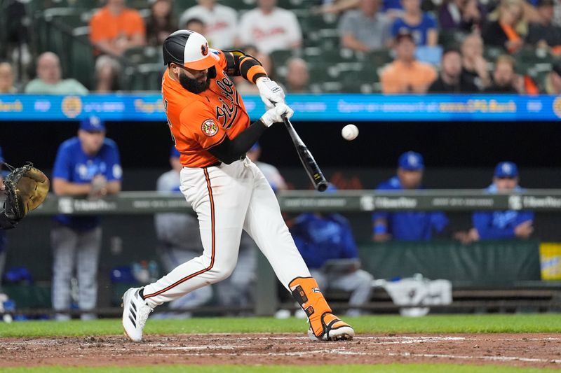 May 3, 2025; Baltimore, Maryland, USA; Baltimore Orioles third baseman Emmanuel Rivera (26) hits a single against the Kansas City Royals during the fifth inning at Oriole Park at Camden Yards. Mandatory Credit: Gregory Fisher-Imagn Images