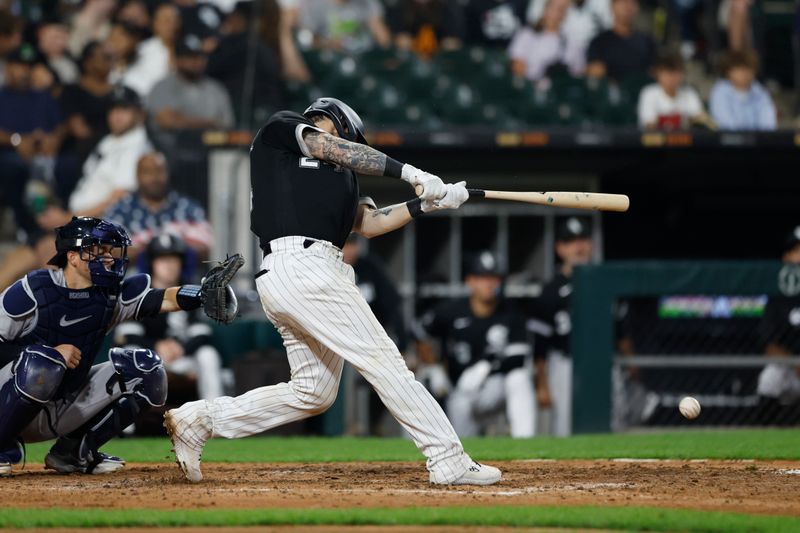 Aug 9, 2023; Chicago, Illinois, USA; Chicago White Sox catcher Yasmani Grandal (24) singles against the New York Yankees during the eight inning at Guaranteed Rate Field. Mandatory Credit: Kamil Krzaczynski-USA TODAY Sports