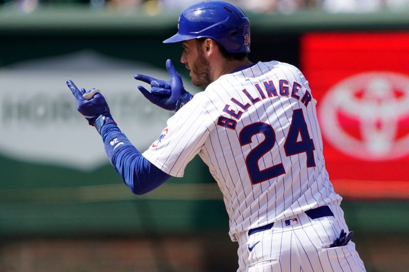 May 19, 2024; Chicago, Illinois, USA; Chicago Cubs outfielder Cody Bellinger (24) gestures after hitting a double against the Pittsburgh Pirates during the sixth inning at Wrigley Field. Mandatory Credit: David Banks-USA TODAY Sports