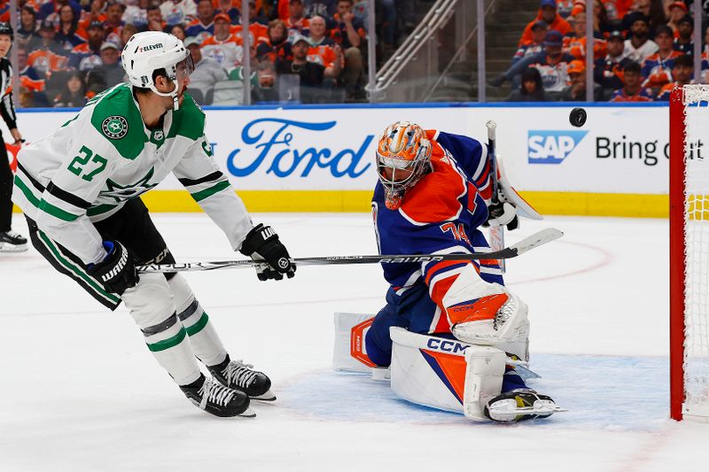May 27, 2024; Edmonton, Alberta, CAN;  Edmonton Oilers goaltender Stuart Skinner (74) makes a save on  on Dallas Stars forward Mason Marchment (27) during the second period in game three of the Western Conference Final of the 2024 Stanley Cup Playoffs at Rogers Place. Mandatory Credit: Perry Nelson-USA TODAY Sports