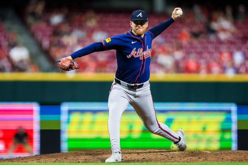 Sep 18, 2024; Cincinnati, Ohio, USA; Atlanta Braves relief pitcher Aaron Bummer (49) pitches against the Cincinnati Reds in the ninth inning at Great American Ball Park. Mandatory Credit: Katie Stratman-Imagn Images