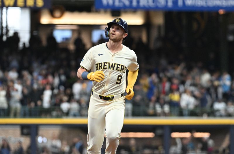 Apr 28, 2024; Milwaukee, Wisconsin, USA; Milwaukee Brewers first base Jake Bauers (9) rounds the bases after hitting a home run against the New York Yankees in the fifth inning at American Family Field. Mandatory Credit: Michael McLoone-USA TODAY Sports