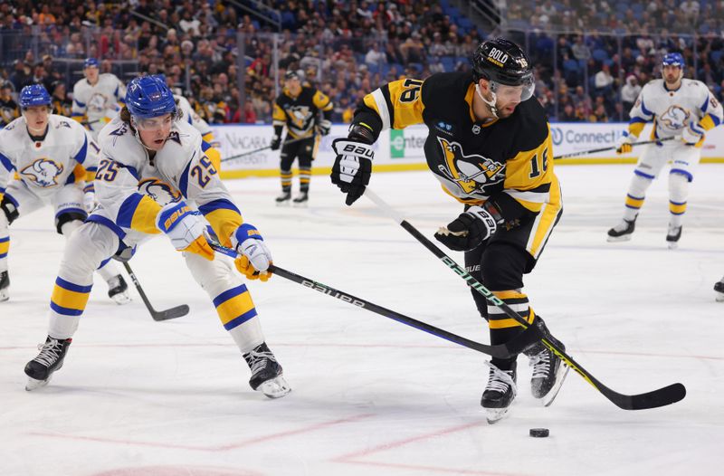 Dec 9, 2022; Buffalo, New York, USA;  Pittsburgh Penguins left wing Jason Zucker (16) tries to control the puck as Buffalo Sabres defenseman Owen Power (25) defends during the first period at KeyBank Center. Mandatory Credit: Timothy T. Ludwig-USA TODAY Sports