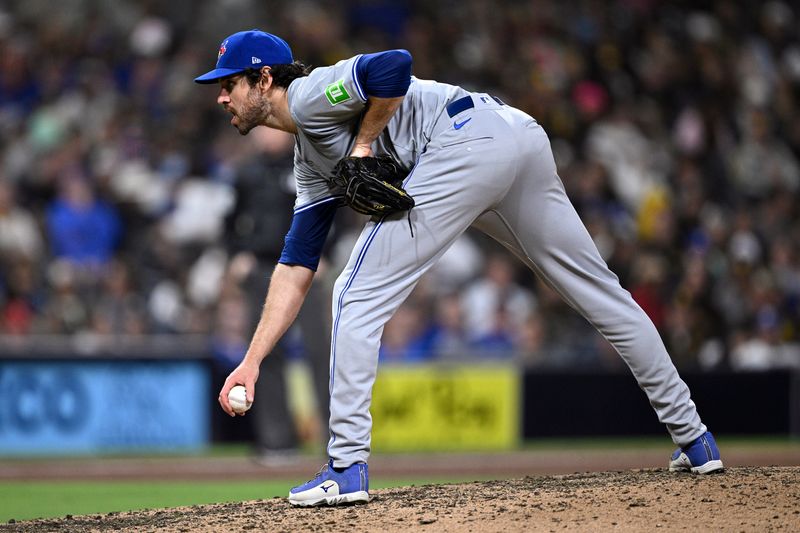 Apr 20, 2024; San Diego, California, USA; Toronto Blue Jays relief pitcher Jordan Romano (68) prepares to pitch against the San Diego Padres during the ninth inning at Petco Park. Mandatory Credit: Orlando Ramirez-USA TODAY Sports