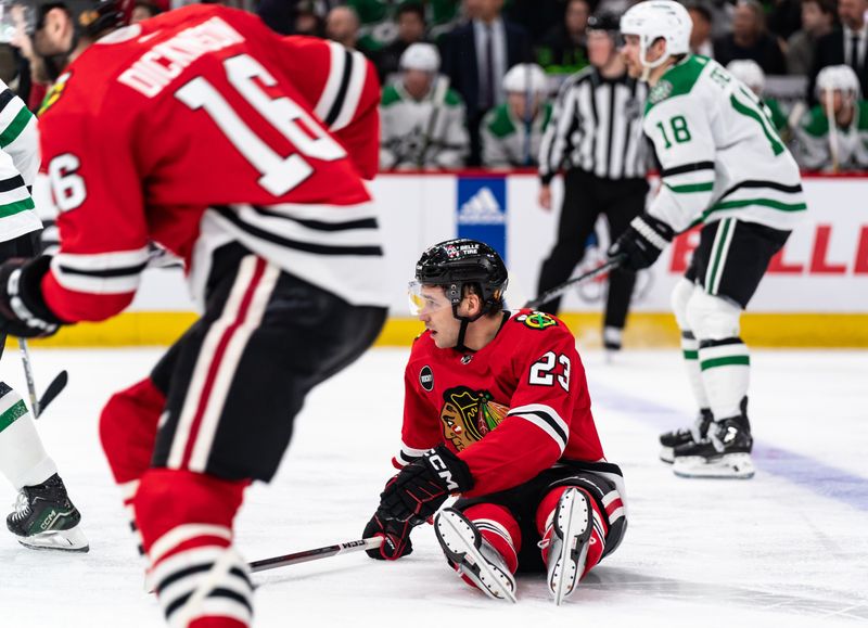 Apr 6, 2024; Chicago, Illinois, USA; Chicago Blackhawks center Philipp Kurashev (23) falls on the ice during the third period at United Center. Mandatory Credit: Seeger Gray-USA TODAY Sports