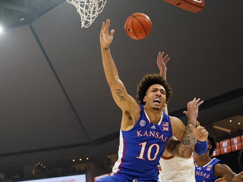 Mar 4, 2023; Austin, Texas, USA; Kansas Jayhawks forward Jalen Wilson (10) reacts while reaching for a rebound during the first half against the Texas Longhorns at Moody Center. Mandatory Credit: Scott Wachter-USA TODAY Sports