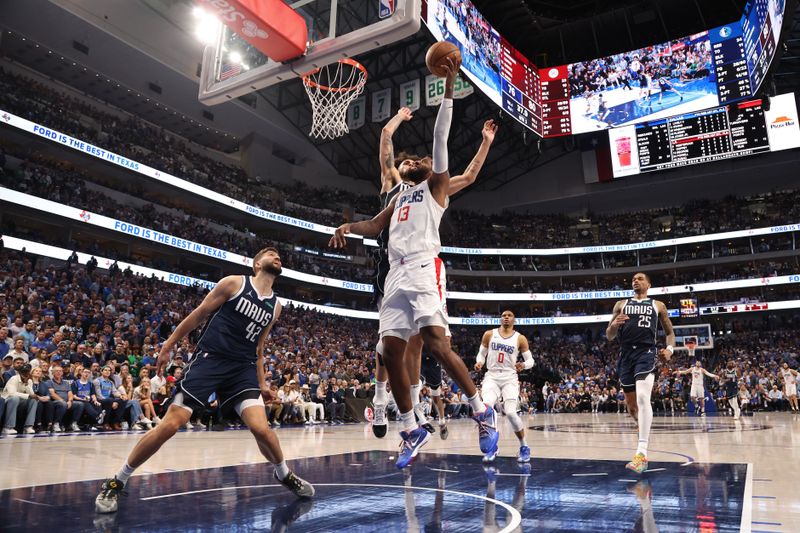 DALLAS, TX - APRIL 28: Paul George #13 of the LA Clippers shoots the ball during the game against the Dallas Mavericks during Round 1 Game 4 of the 2024 NBA Playoffs on April 28, 2024 at the American Airlines Center in Dallas, Texas. NOTE TO USER: User expressly acknowledges and agrees that, by downloading and or using this photograph, User is consenting to the terms and conditions of the Getty Images License Agreement. Mandatory Copyright Notice: Copyright 2024 NBAE (Photo by Tim Heitman/NBAE via Getty Images)