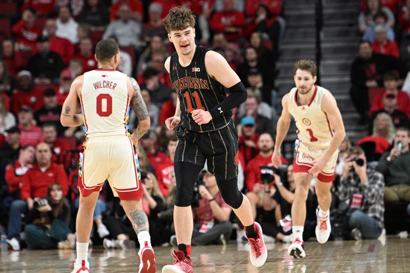 Feb 11, 2023; Lincoln, Nebraska, USA;  Wisconsin Badgers guard Max Klesmit (11) looks to the bench after hitting a three point basket against the Nebraska Cornhuskers in the first half at Pinnacle Bank Arena. Mandatory Credit: Steven Branscombe-USA TODAY Sports