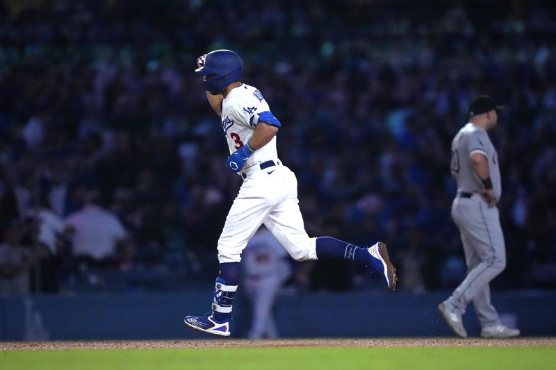 Jun 15, 2023; Los Angeles, California, USA; Los Angeles Dodgers third baseman Chris Taylor (3) rounds the bases on a grand slam home run in the sixth inning against the Chicago White Sox at Dodger Stadium. Mandatory Credit: Kirby Lee-USA TODAY Sports