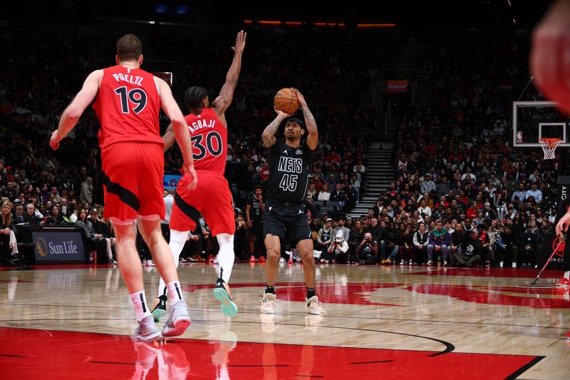 TORONTO, CANADA - JANUARY 01: Keon Johnson #45 of the Brooklyn Nets shoots a three point basket during the game on January 1, 2025 at the Scotiabank Arena in Toronto, Ontario, Canada.  NOTE TO USER: User expressly acknowledges and agrees that, by downloading and or using this Photograph, user is consenting to the terms and conditions of the Getty Images License Agreement.  Mandatory Copyright Notice: Copyright 2025 NBAE (Photo by Vaughn Ridley/NBAE via Getty Images)