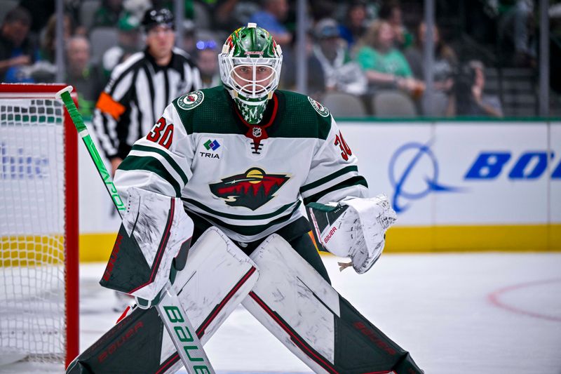 Sep 29, 2022; Dallas, Texas, USA; Minnesota Wild goaltender Jesper Wallstedt (30) faces the Dallas Stars attack during the second period at the American Airlines Center. Mandatory Credit: Jerome Miron-USA TODAY Sports