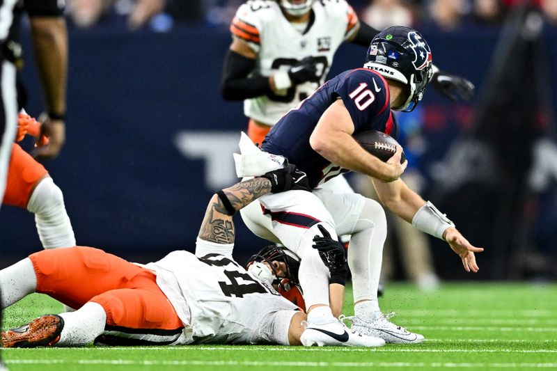 Cleveland Browns linebacker Sione Takitaki (44) tackles Houston Texans quarterback Davis Mills (10) during an NFL football game, Sunday, Dec 24, 2023, in Houston. (AP Photo/Maria Lysaker)