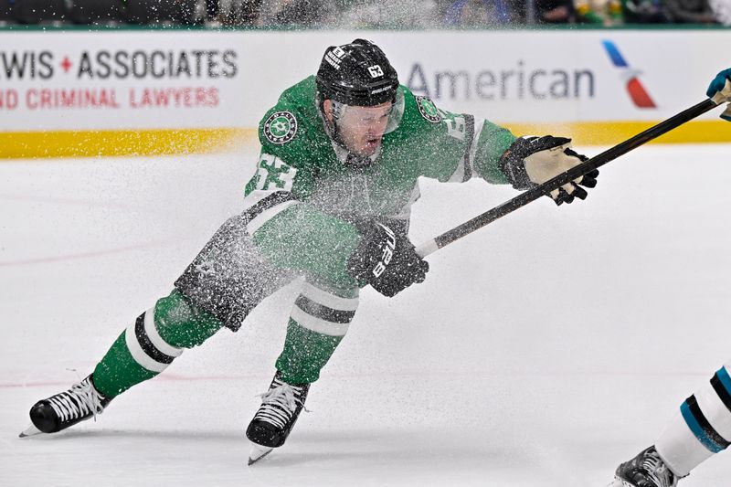 Nov 20, 2024; Dallas, Texas, USA; Dallas Stars right wing Evgenii Dadonov (63) chases the puck in the San Jose Sharks zone during the second period at the American Airlines Center. Mandatory Credit: Jerome Miron-Imagn Images