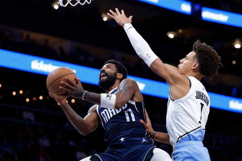 ATLANTA, GEORGIA - NOVEMBER 25: Kyrie Irving #11 of the Dallas Mavericks goes up for a shot against Jalen Johnson #1 of the Atlanta Hawks during the first half at State Farm Arena on November 25, 2024 in Atlanta, Georgia. NOTE TO USER: User expressly acknowledges and agrees that, by downloading and or using this photograph, User is consenting to the terms and conditions of the Getty Images License Agreement. (Photo by Todd Kirkland/Getty Images)