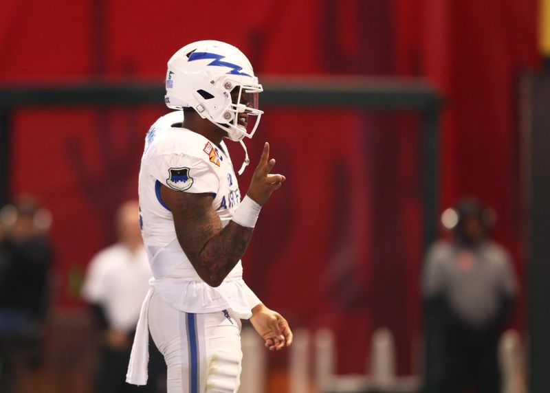 Dec 27, 2019; Phoenix, Arizona, USA; Air Force Falcons quarterback Donald Hammond III (5) celebrates a rushing touchdown against the Washington State during the first half of the Cheez-It Bowl at Chase Field. Mandatory Credit: Mark J. Rebilas-USA TODAY Sports