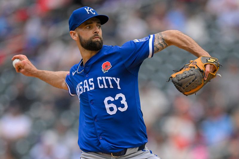 May 27, 2024; Minneapolis, Minnesota, USA; Kansas City Royals relief pitcher Nick Anderson (63) delivers a pitch against the Minnesota Twins during the eighth inning at Target Field. Mandatory Credit: Nick Wosika-USA TODAY Sports