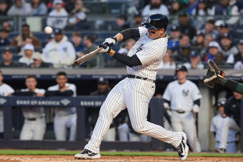 Apr 23, 2024; Bronx, New York, USA; New York Yankees first base Anthony Rizzo (48) hits a two-run home run during the first inning against the Oakland Athletics at Yankee Stadium. Mandatory Credit: Vincent Carchietta-USA TODAY Sports