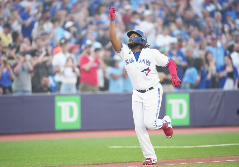 Jun 29, 2023; Toronto, Ontario, CAN; Toronto Blue Jays designated hitter Vladimir Guerrero Jr. (27) celebrates as he runs the bases after hitting a two run home run against the San Francisco Giants during the sixth inning at Rogers Centre. Mandatory Credit: Nick Turchiaro-USA TODAY Sports