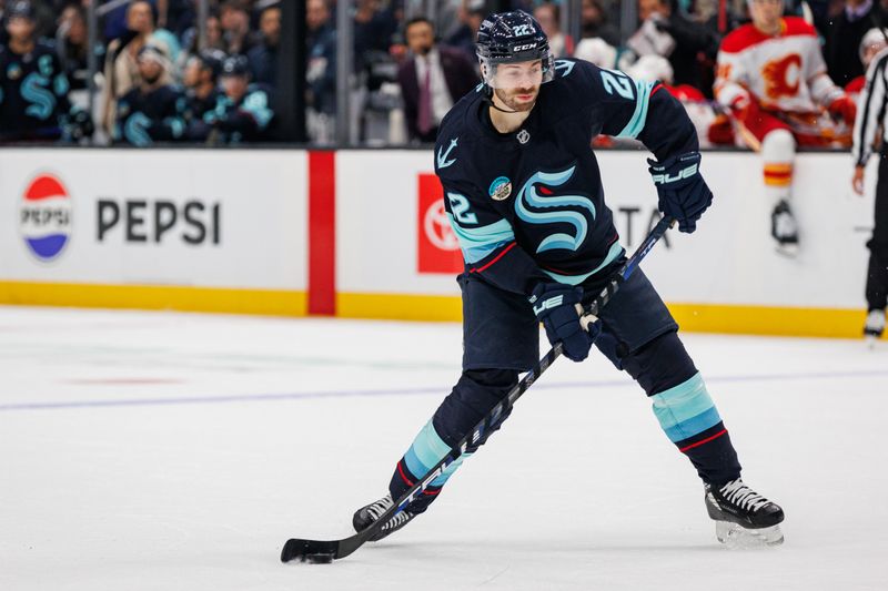 Oct 19, 2024; Seattle, Washington, USA; Seattle Kraken right wing Oliver Bjorkstrand (22) shoots against the Calgary Flames during the first period at Climate Pledge Arena. Mandatory Credit: Caean Couto-Imagn Images