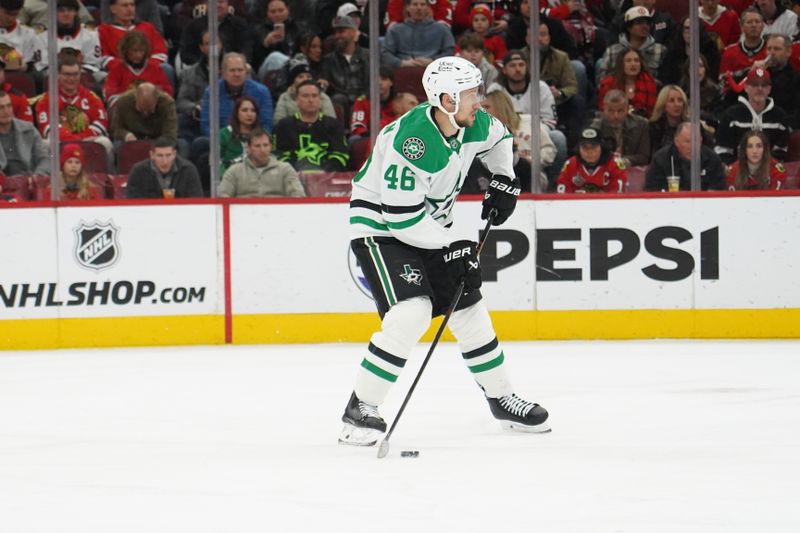 Jan 1, 2026; Chicago, Illinois, USA; Dallas Stars defenseman Ilya Lyubushkin (46) moves the puck up the ice against the Chicago Blackhawks during the first period at United Center. Mandatory Credit: David Banks-Imagn Images