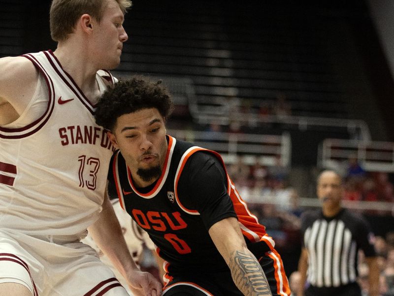 Feb 24, 2024; Stanford, California, USA; Oregon State Beavers guard Jordan Pope (0) collides with Stanford Cardinal guard Michael Jones (13) during the first half at Maples Pavilion. Mandatory Credit: D. Ross Cameron-USA TODAY Sports