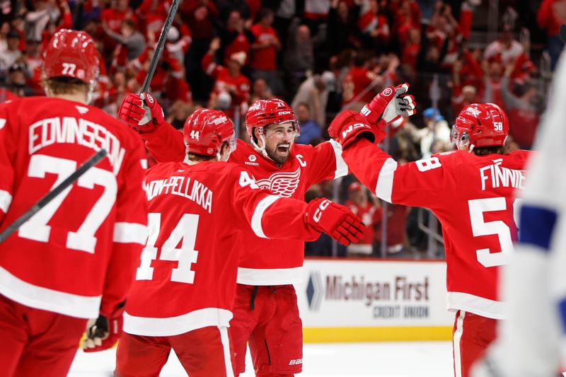 Oct 17, 2025; Detroit, Michigan, USA; Detroit Red Wings center Dylan Larkin (71) scores the game winning goal in overtime against Tampa Bay Lightning goaltender Andrei Vasilevskiy (88) at Little Caesars Arena. Mandatory Credit: Brian Bradshaw Sevald-Imagn Images