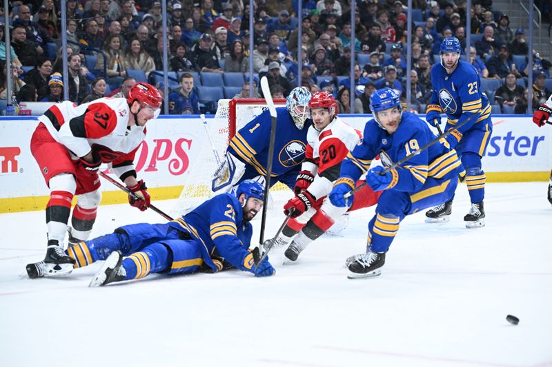 Nov 23, 2025; Buffalo, New York, USA; Buffalo Sabres defenseman Conor Timmins (21) lays out to defend the goal with Carolina Hurricanes right wing Andrei Svechnikov (37) and center Sebastian Aho (20) nearby in the third period at KeyBank Center. Mandatory Credit: Mark Konezny-Imagn Images