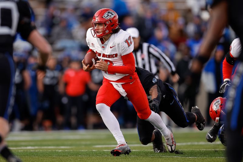 Nov 12, 2022; Colorado Springs, Colorado, USA; New Mexico Lobos quarterback Justin Holaday (12) runs the ball in the third quarter against the Air Force Falcons at Falcon Stadium. Mandatory Credit: Isaiah J. Downing-USA TODAY Sports