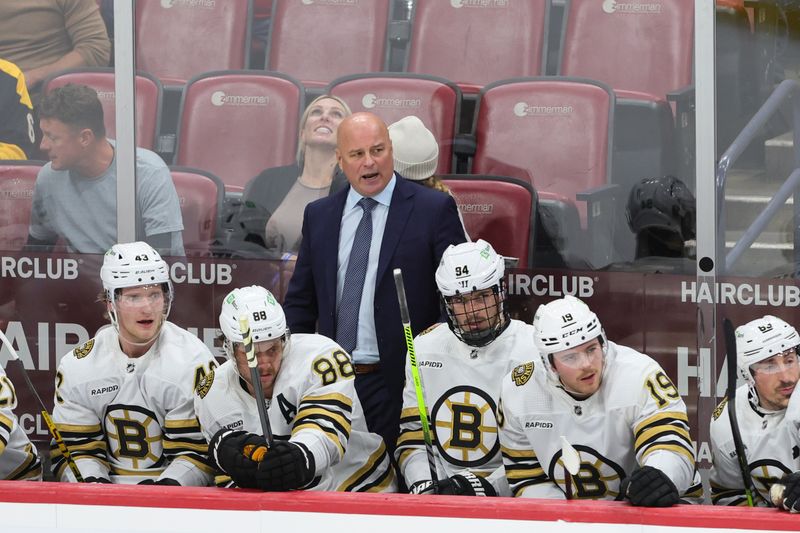 Nov 22, 2023; Sunrise, Florida, USA; Boston Bruins head coach Jim Montgomery reacts from the bench against the Florida Panthers during the third period at Amerant Bank Arena. Mandatory Credit: Sam Navarro-USA TODAY Sports