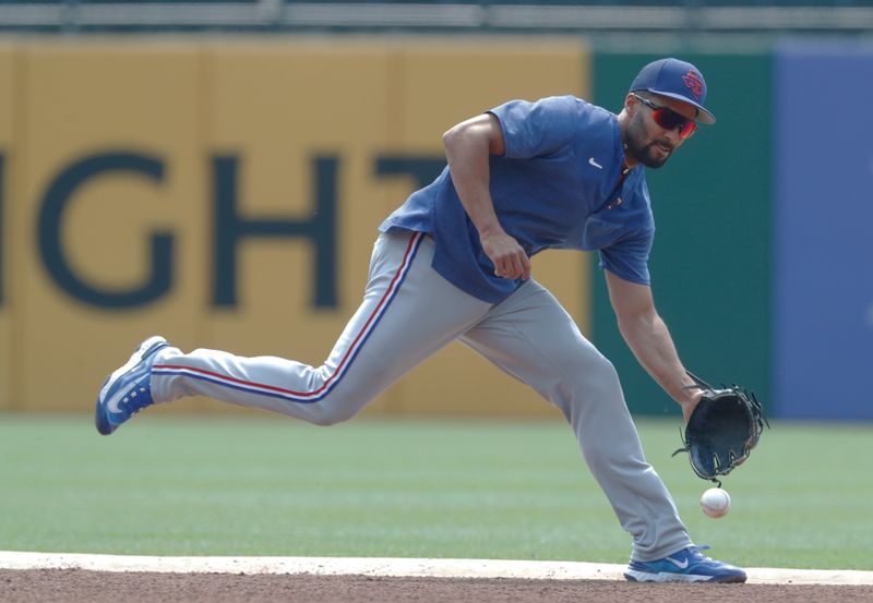 May 24, 2023; Pittsburgh, Pennsylvania, USA; Texas Rangers second baseman Marcus Semien (2) takes ground balls before the game against the Pittsburgh Pirates at PNC Park. Mandatory Credit: Charles LeClaire-USA TODAY Sports