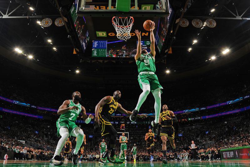 BOSTON, MA - MARCH 3: Derrick White #9 of the Boston Celtics drives to the basket during the game against the Golden State Warriors on March 3, 2024 at the TD Garden in Boston, Massachusetts. NOTE TO USER: User expressly acknowledges and agrees that, by downloading and or using this photograph, User is consenting to the terms and conditions of the Getty Images License Agreement. Mandatory Copyright Notice: Copyright 2024 NBAE  (Photo by Brian Babineau/NBAE via Getty Images)