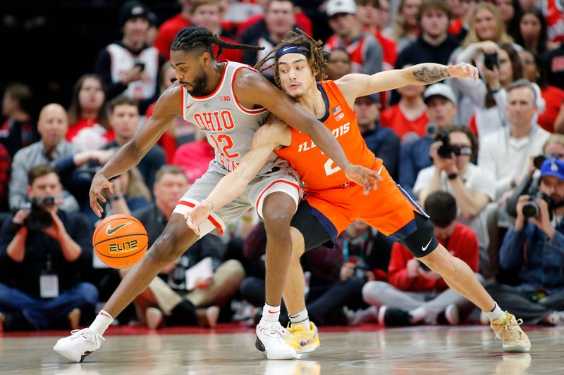 Jan 30, 2024; Columbus, Ohio, USA; Ohio State Buckeyes guard Evan Mahaffey (12) controls the ball as Illinois Fighting Illini guard Dra Gibbs-Lawhorn (2) defends on the play during the second half at Value City Arena. Mandatory Credit: Joseph Maiorana-USA TODAY Sports