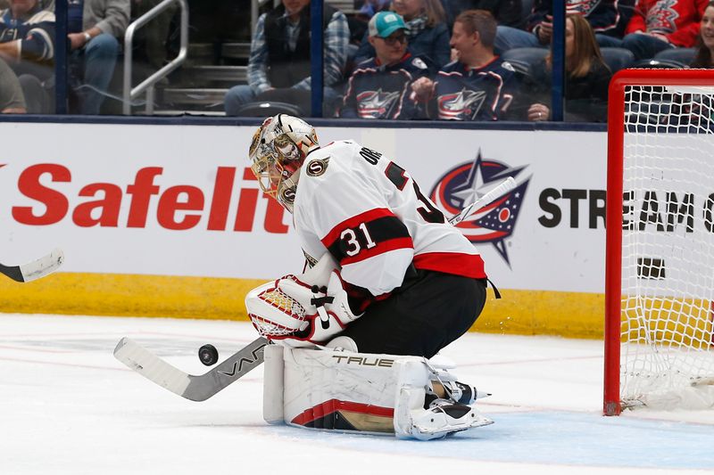 Mar 14, 2024; Columbus, Ohio, USA; Ottawa Senators goalie Anton Forsberg (31) makes a save against the Columbus Blue Jackets during the first period at Nationwide Arena. Mandatory Credit: Russell LaBounty-USA TODAY Sports