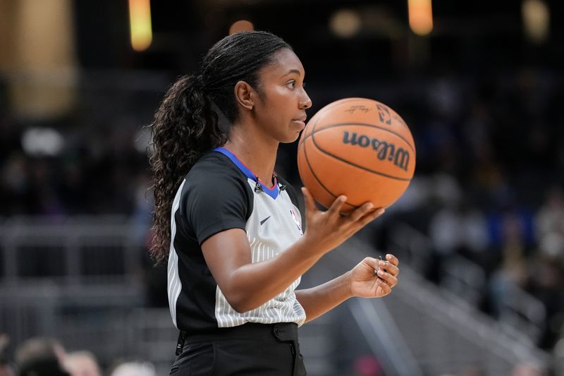 INDIANAPOLIS, INDIANA - OCTOBER 17: Referee Danielle Scott looks on during a preseason game between the Charlotte Hornets and the Indiana Pacers at Gainbridge Fieldhouse on October 17, 2024 in Indianapolis, Indiana. NOTE TO USER: User expressly acknowledges and agrees that, by downloading and or using this photograph, User is consenting to the terms and conditions of the Getty Images License Agreement. (Photo by Dylan Buell/Getty Images)