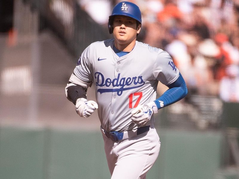 Jun 29, 2024; San Francisco, California, USA; Los Angeles Dodgers two-way player Shohei Ohtani (17) rounds the bases after hitting a home run against the San Francisco Giants during the third inning at Oracle Park. Mandatory Credit: Ed Szczepanski-USA TODAY Sports