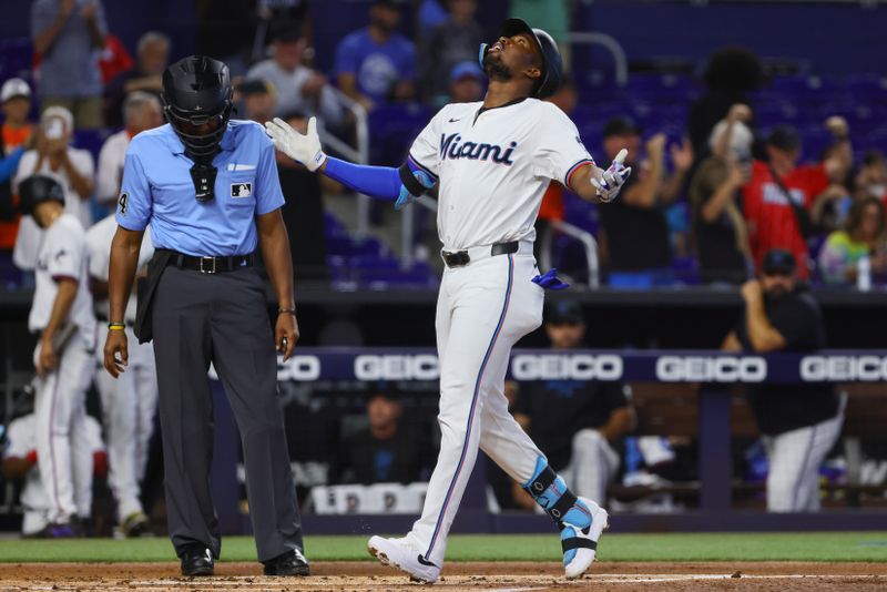 Jun 19, 2024; Miami, Florida, USA; Miami Marlins right fielder Jesus Sanchez (12) reacts after hitting a home run against the St. Louis Cardinals during the first inning at loanDepot Park. Mandatory Credit: Sam Navarro-USA TODAY Sports