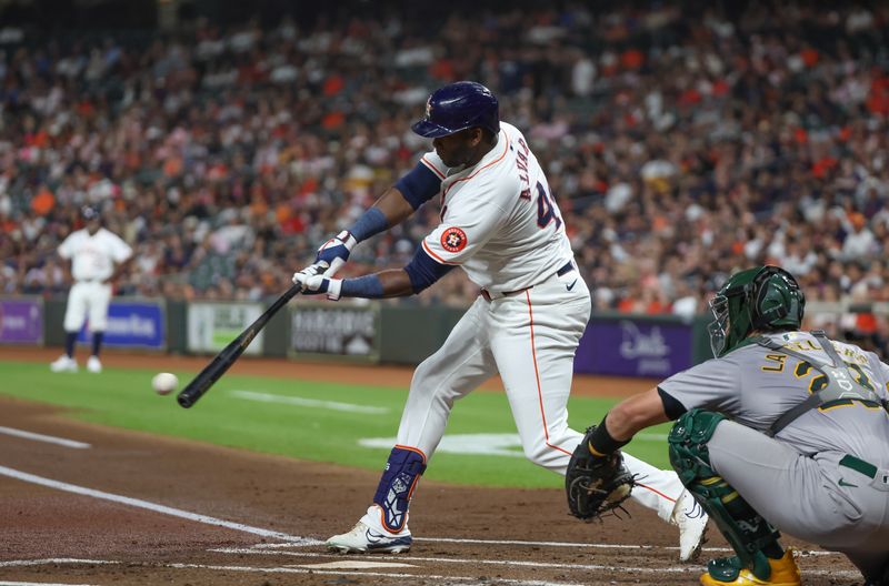 Sep 10, 2024; Houston, Texas, USA;  Houston Astros left fielder Yordan Alvarez (44) hits a single against the Oakland Athletics in the first inning at Minute Maid Park. Mandatory Credit: Thomas Shea-Imagn Images