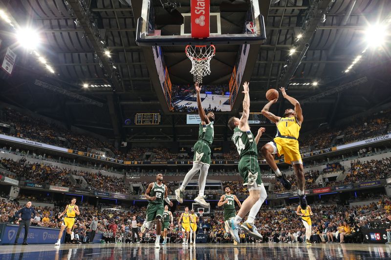 INDIANAPOLIS, IN - APRIL 28: Obi Toppin #1 of the Indiana Pacers drives to the basket during the game against the Milwaukee Bucks during Round 1 Game 4 of the 2024 NBA Playoffs on April 28, 2024 at Gainbridge Fieldhouse in Indianapolis, Indiana. NOTE TO USER: User expressly acknowledges and agrees that, by downloading and or using this Photograph, user is consenting to the terms and conditions of the Getty Images License Agreement. Mandatory Copyright Notice: Copyright 2024 NBAE (Photo by Nathaniel S. Butler/NBAE via Getty Images)