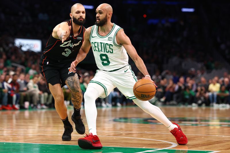 BOSTON, MASSACHUSETTS - MARCH 18: Evan Fournier #31 of the Detroit Pistons defends Derrick White #9 of the Boston Celtics during the first quarter at TD Garden on March 18, 2024 in Boston, Massachusetts. NOTE TO USER: User expressly acknowledges and agrees that, by downloading and or using this photograph, user is consenting to the terms and conditions of the Getty Images License Agreement. (Photo by Maddie Meyer/Getty Images)